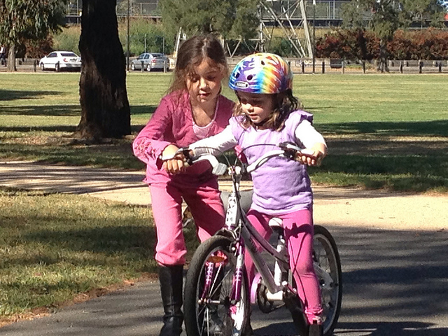 cory kids helping each other learn to ride